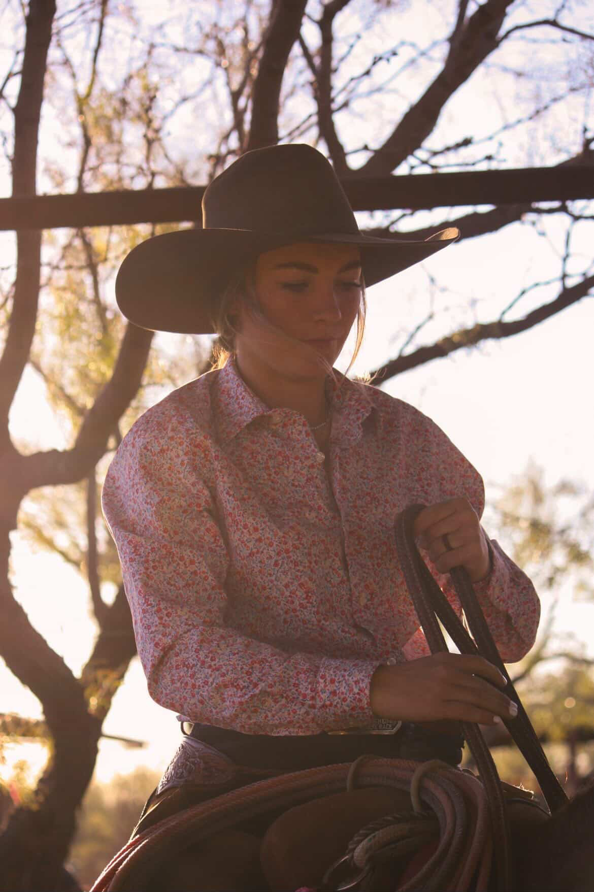 Young rider with horse in open West Texas country