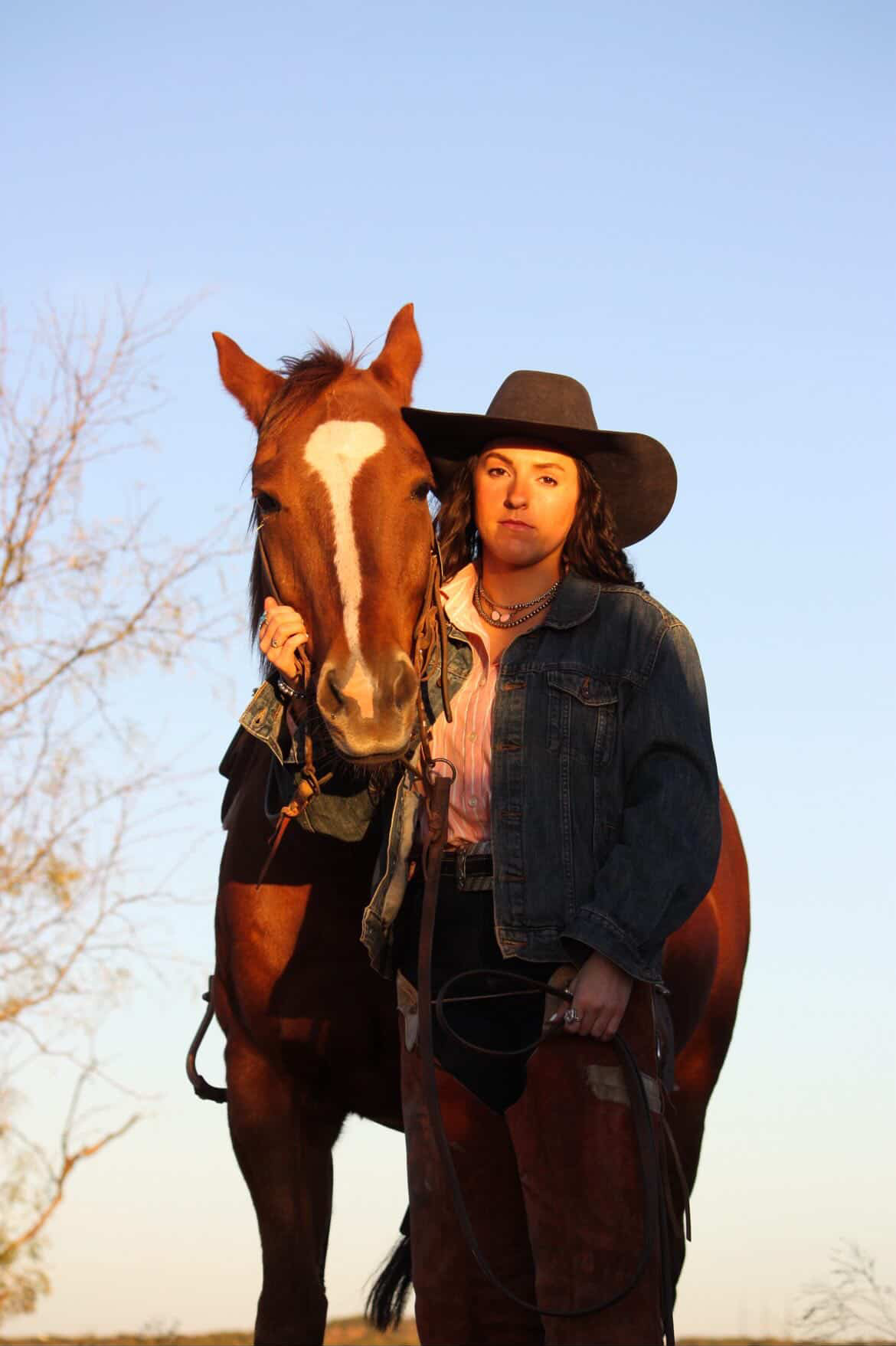 Western portrait with horse at sunset